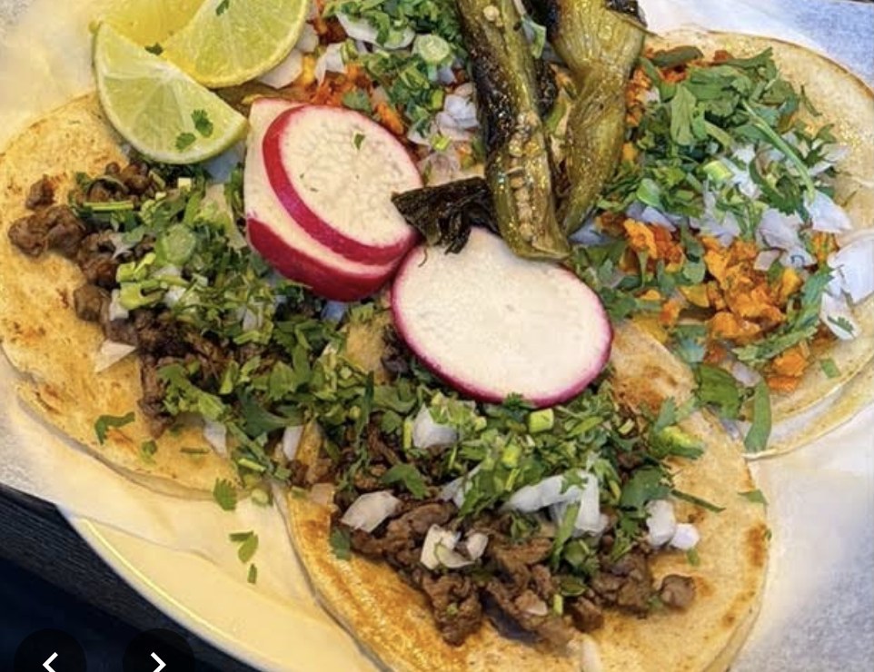Street tacos close-up with radish and lime
